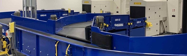 Powered Curve Systems for Airport baggage handling