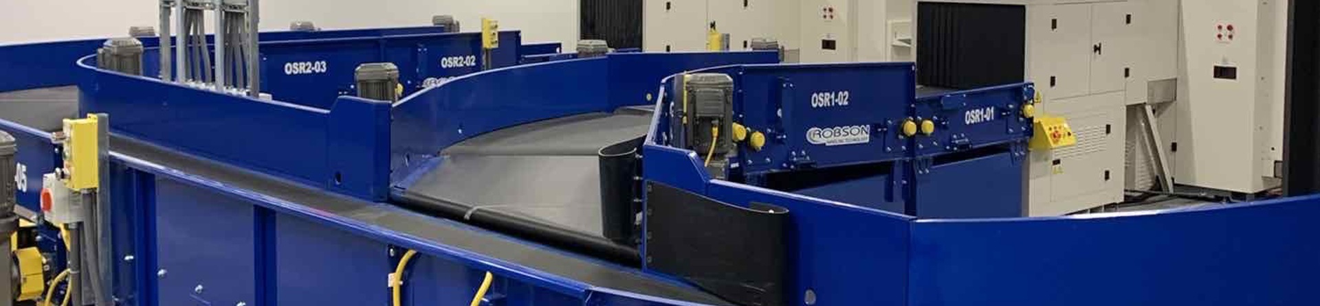 Powered Curve Systems for Airport baggage handling